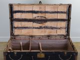 an old trunk that is open on the floor