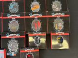 a lot of badges that are on a black table