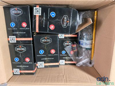 several boxes of various items are stacked in a cardboard box