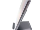 a cell phone that is sitting on top of a stand