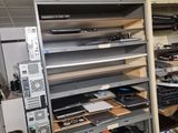 a room with a lot of electronic equipment on the shelves