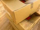 boxes stacked on top of each other on the floor in a living room
