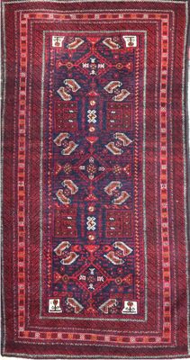 a red and blue rug with a pattern on it
