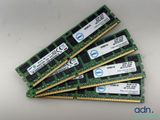 four memory modules are stacked on top of each other on a table