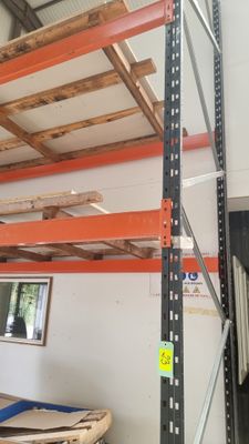 a large rack in the middle of a room with shelves