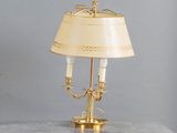 a table with a lamp and a vase on it