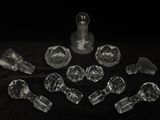 a lot of clear glass pieces on a black surface