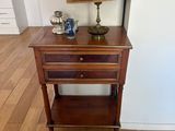 a small table with a lamp on top of it