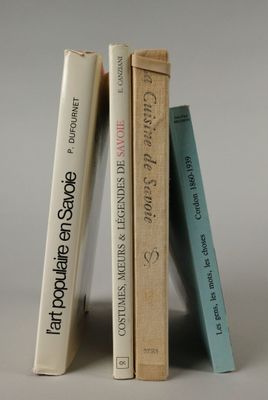 three books that are stacked on top of each other