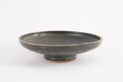 bowl with black glaze glaze on a white background