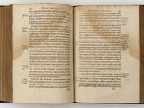 an open book on a table with a white background