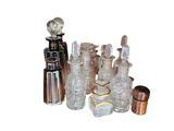 a lot of glass bottles that are sitting on a table