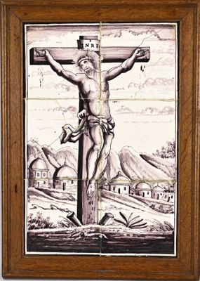 painting of jesus on the cross in a wood frame on a wall