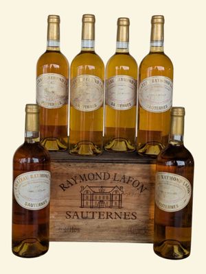 six bottles of white wine in a wooden crate on a white background