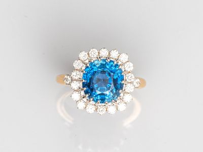 an oval blue topaz sapphire and diamond cluster ring