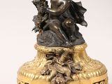 an image of a statue of a woman sitting on top of a table