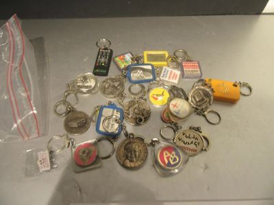 a lot of key chains that are sitting on a table
