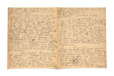an old book with writing on it sitting on top of a table