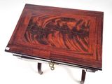 a small table with a wooden top and a metal handle