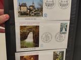 a person holding a folder with stamps on it
