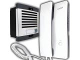 a white and black phone and a white wall mounted air conditioner
