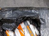 a plastic bag with a pair of scissors inside of it