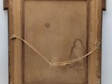 an old picture frame with a piece of paper taped around it