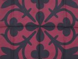 a close up of a red and black fabric with a black and white pattern