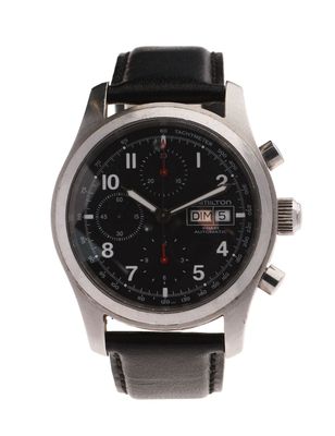 a close up of a watch on a white background