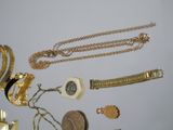 a lot of gold and silver jewelry on a table