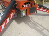 a crane that is sitting on the side of the road