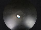 a small piece of paper on the top of a black object