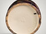 an image of a close up of a vase with a tag on it