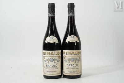 two bottles of wine sitting next to each other on a white surface