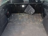a trunk of a car with the back seats folded down