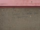 a message written on the side of a pink building