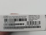 a person holding a white box with a barcode on it