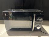 a microwave that is sitting on a counter top