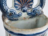 a blue and white vase with a dragon on it