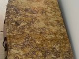 a table that has a marble top on it