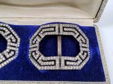 pair of art deco brooches in silver and blue velvet case