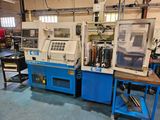 two machines that are sitting in a room together