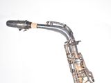 a close up of a saxophone on a white background