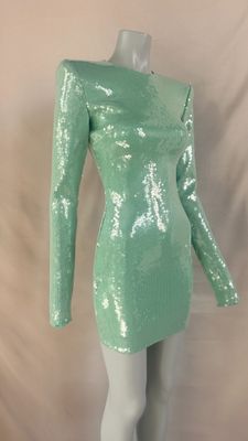 a green sequinized dress on a mannequin mannequin mannequin mannequin mannequin mannequin mannequin mannequin