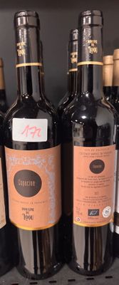 many bottles of wine sitting on a shelf in a store
