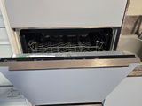a dishwasher that is open in the kitchen