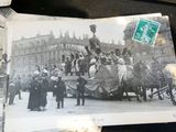 a black and white photo of a horse drawn carriage with people on it