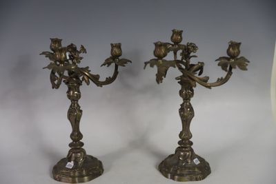 pair of antique brass candlesticks with flowers and leaves