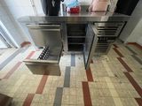 an image of a commercial kitchen with stainless steel appliances