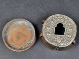 an antique silver plated box with a key in it